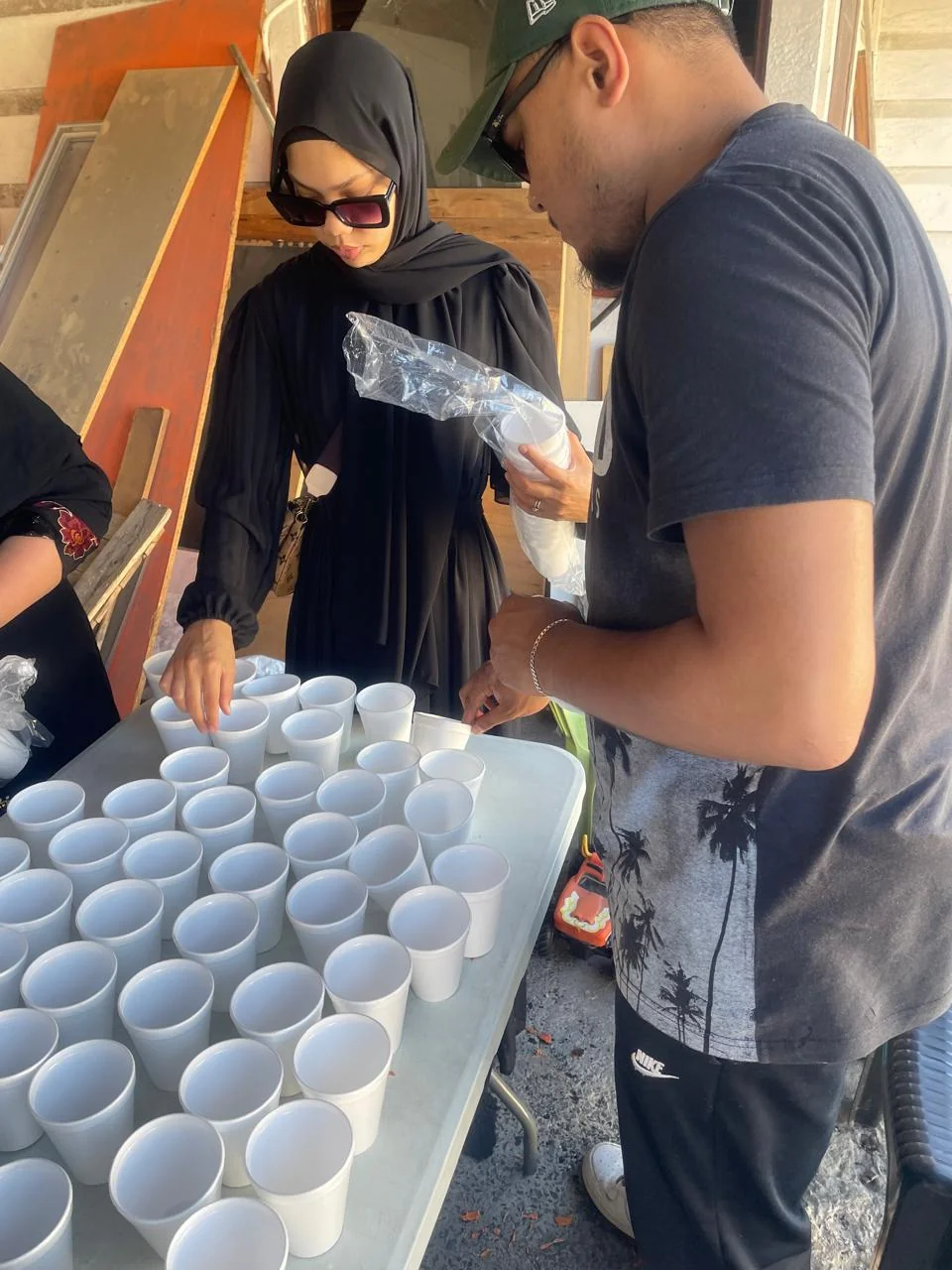 DUAZAF volunteers working together during a community outreach day