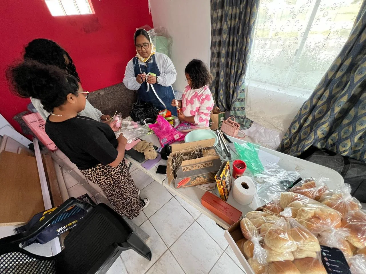 Adults taking part in a practical skills training workshop